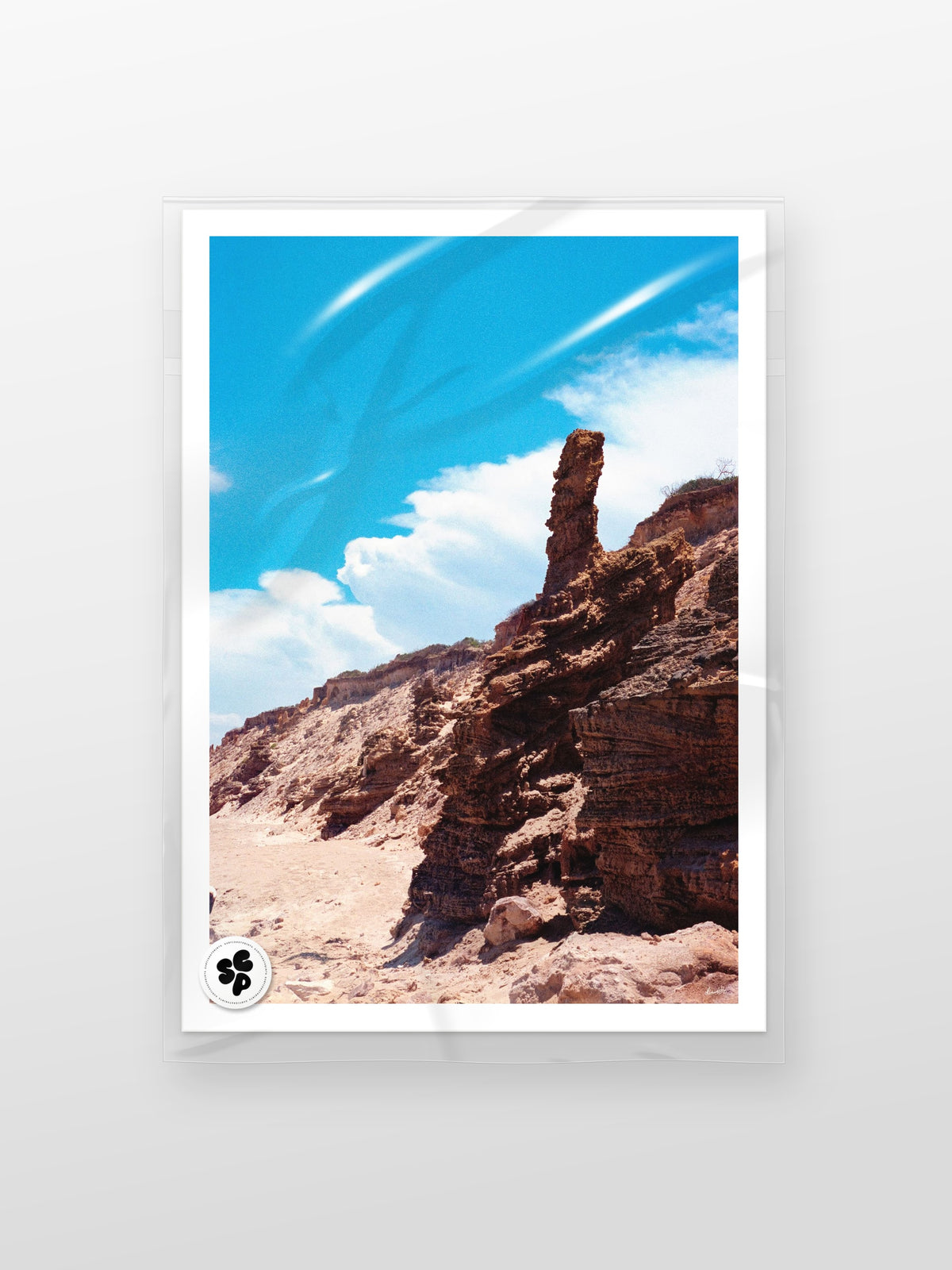 Thirteenth Beach Rock Tower print in a protective sleeve