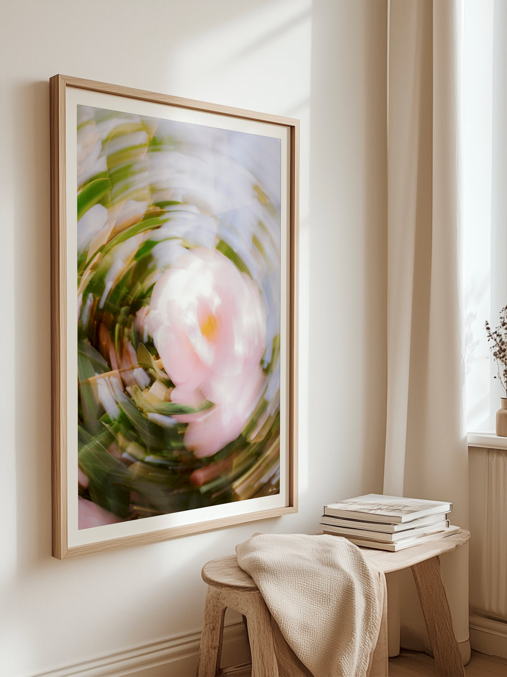 Bright Flower Series - Camellia Japonica Pink framed print hanging above a timber stool beside a window