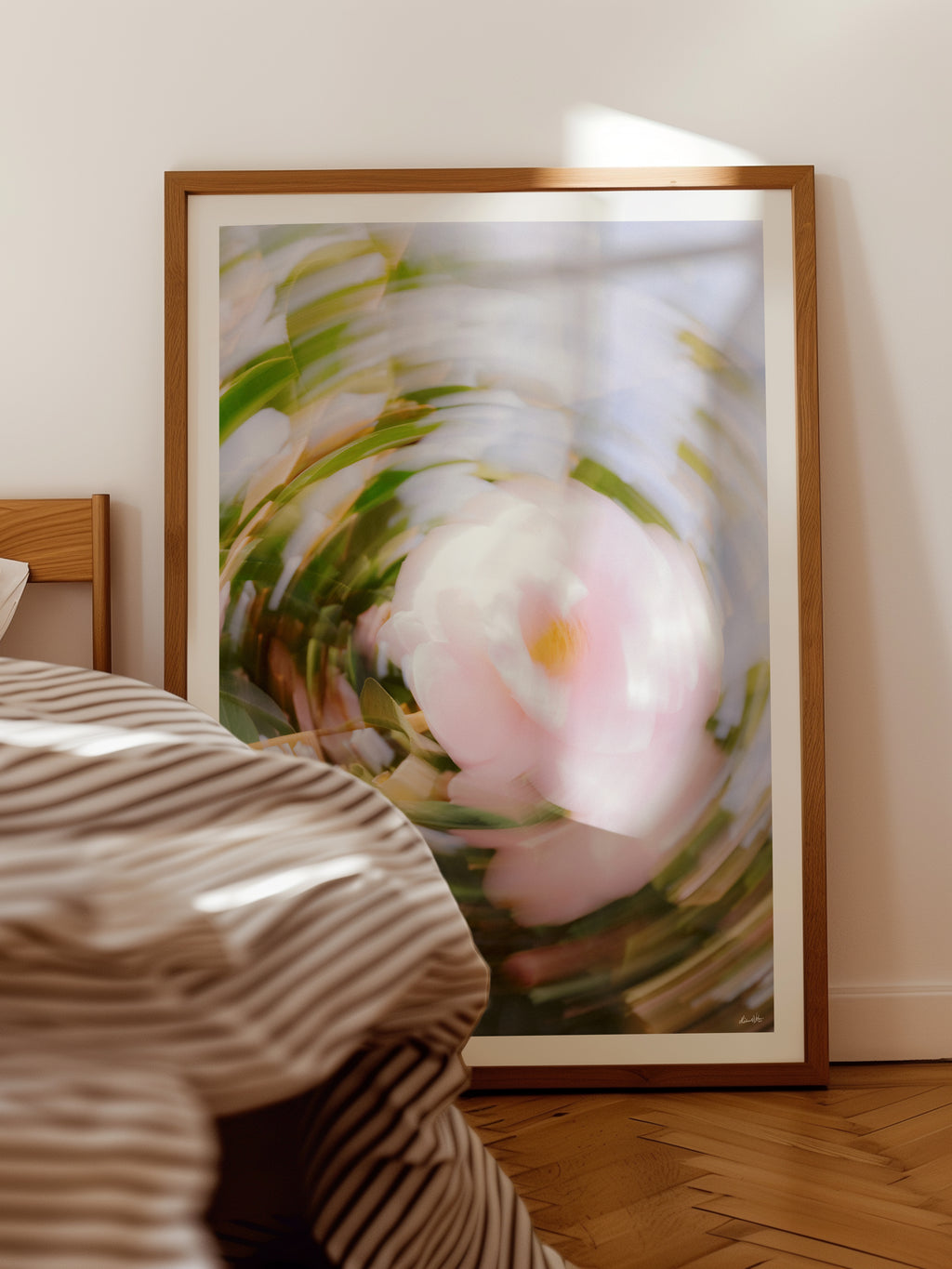 Bright Flower Series - Camellia Japonica Pink framed print leaning against a bedroom wall beside the bed