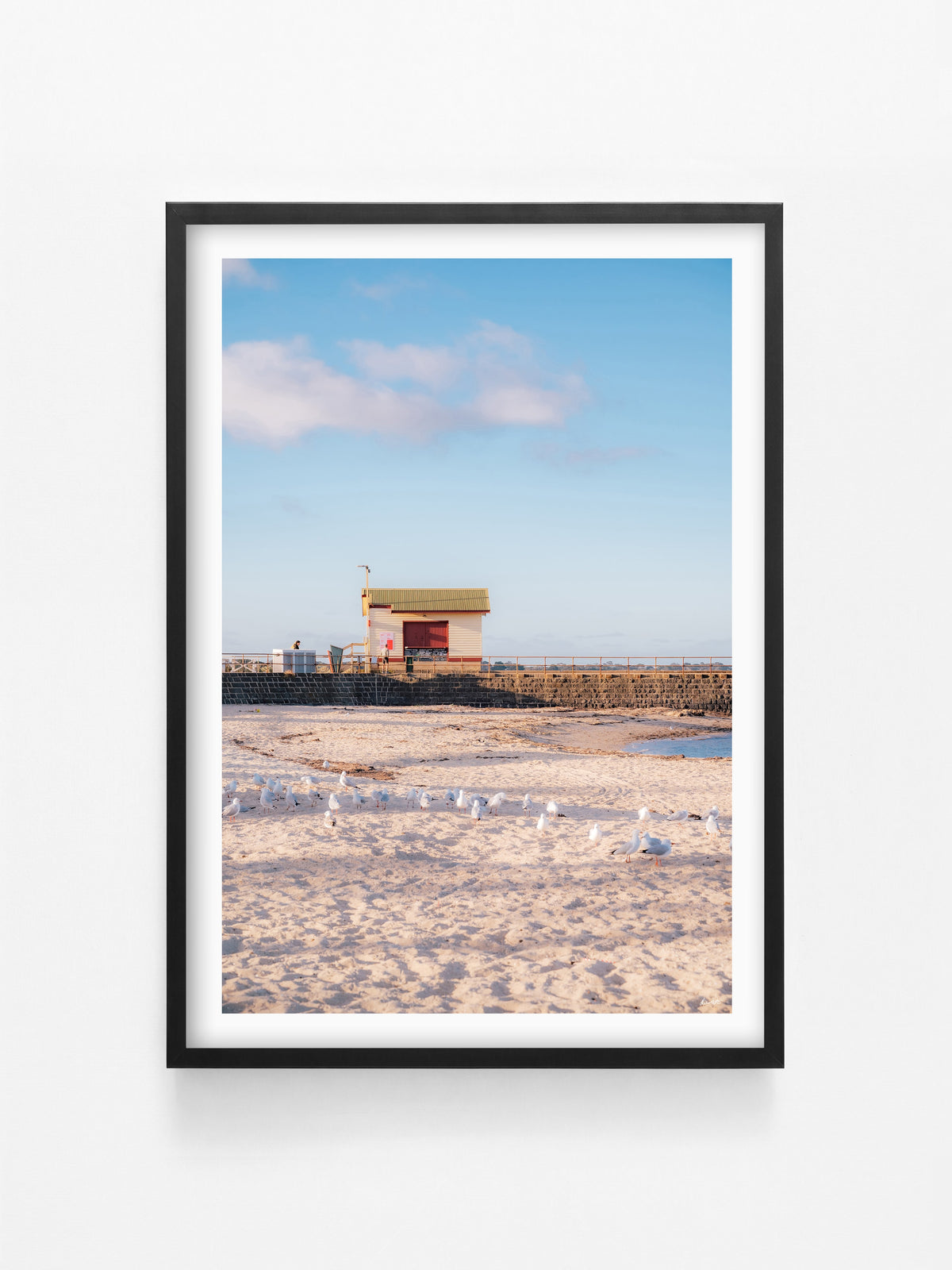 St Leonards Pier Kiosk in Fading Light Portrait print in a black shadowbox frame
