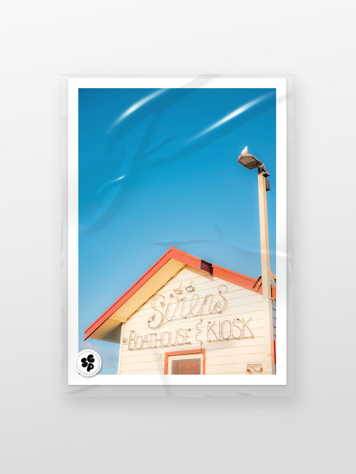 St Leonards Sirens Boathouse & Kiosk print in a protective sleeve
